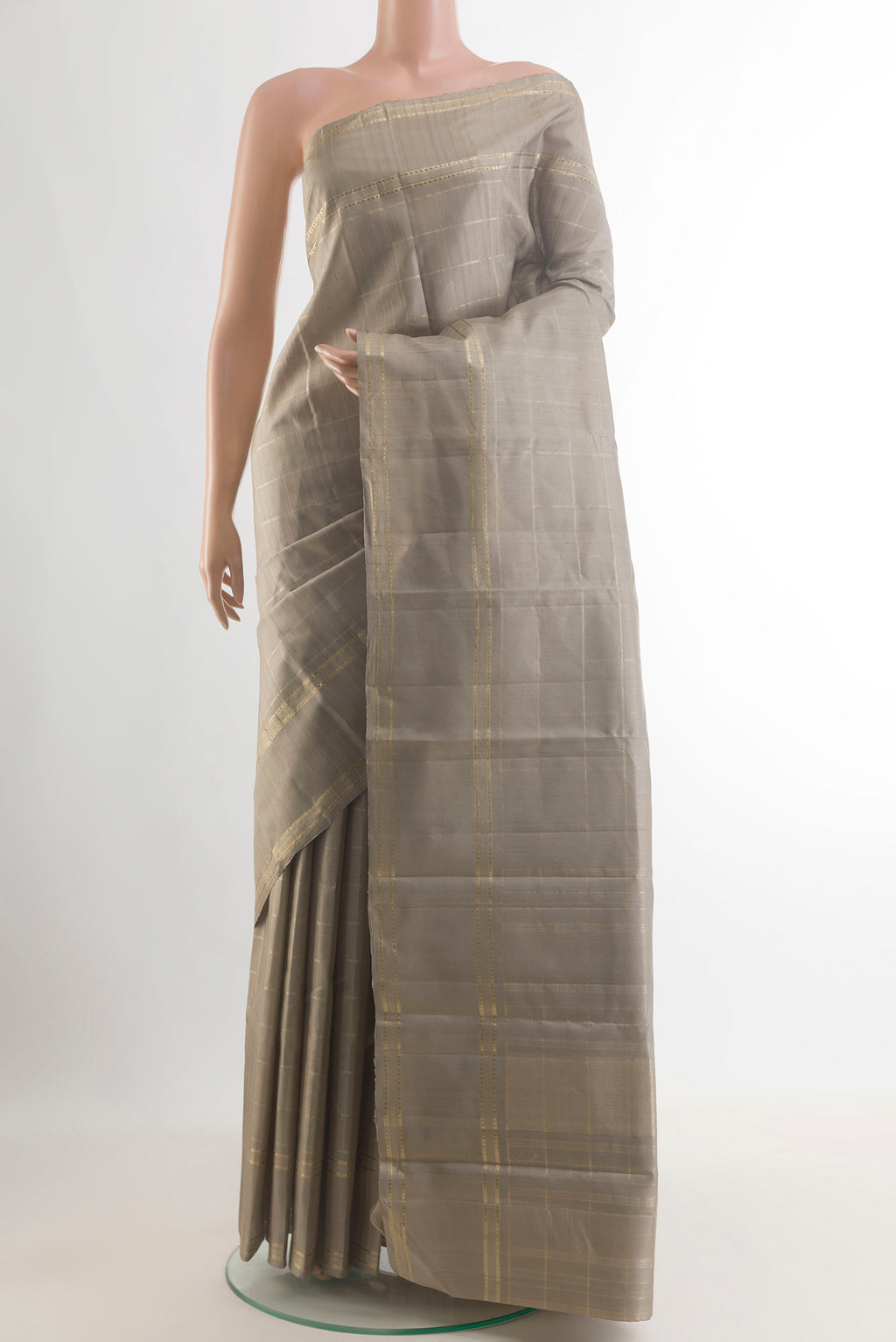 Pure Silk Grey Kanchipuram Saree with Checked design on the body and Zari Border.  displayed on a mannequin