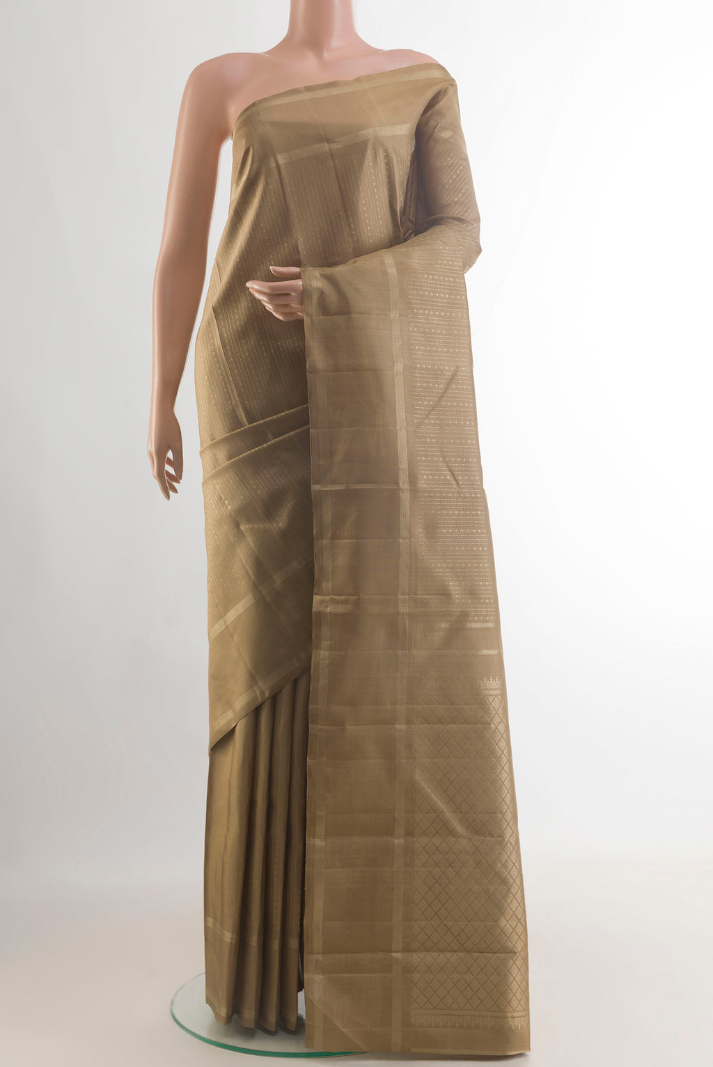 Pure Silk Beige Kanchipuram Saree with Stripes on the body and Plain Border.  displayed on a mannequin