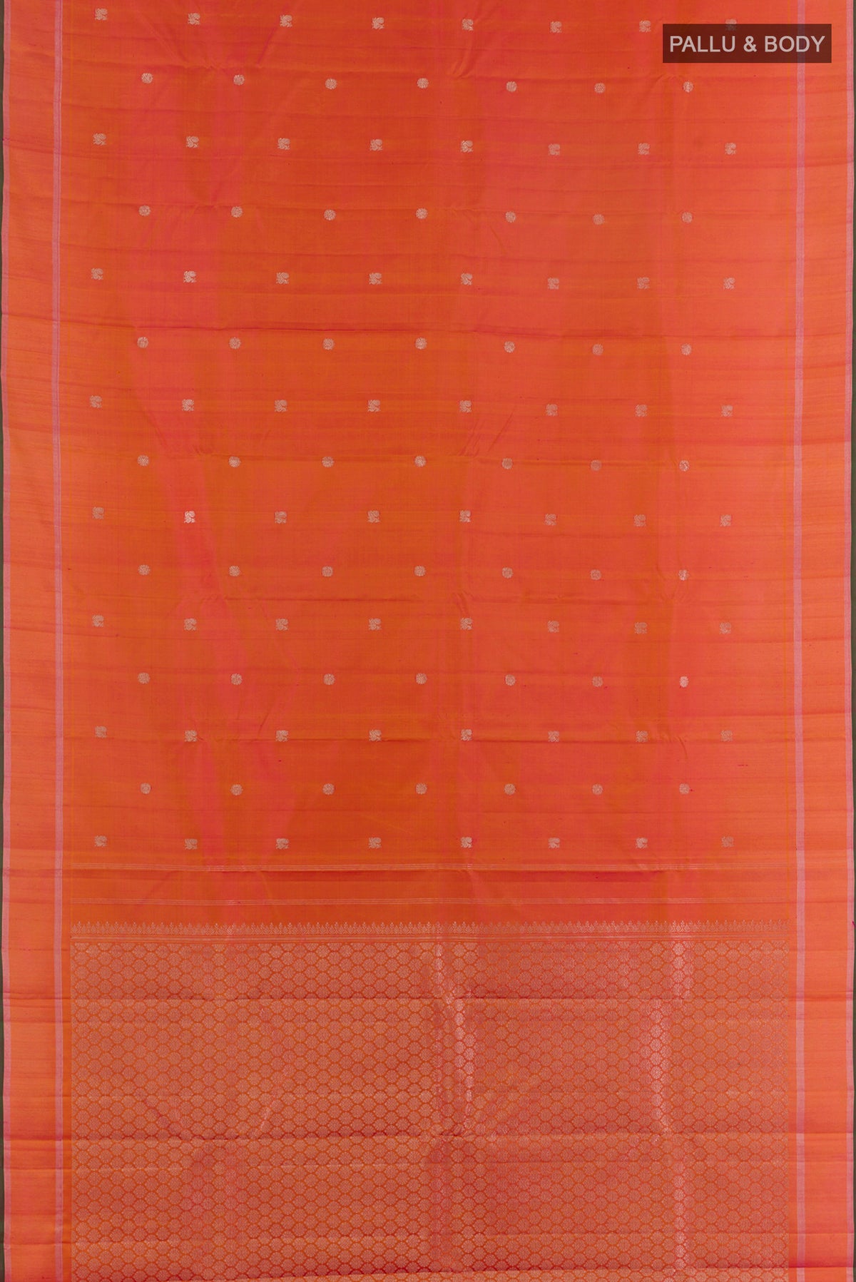 Flat view of Pure Silk Brick Orange Kanchipuram Saree with Zari Butta on the body and Zari Border. 