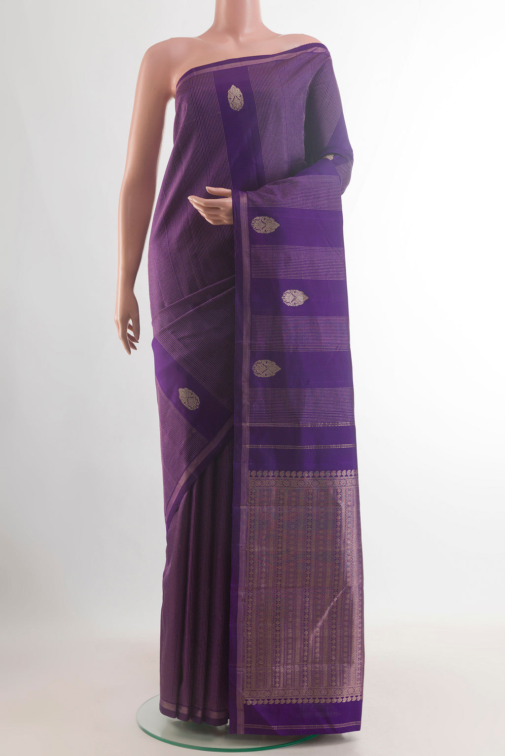 Pure Silk Purple Kanchipuram Saree with Zari Butta on the body and Zari Border.  displayed on a mannequin