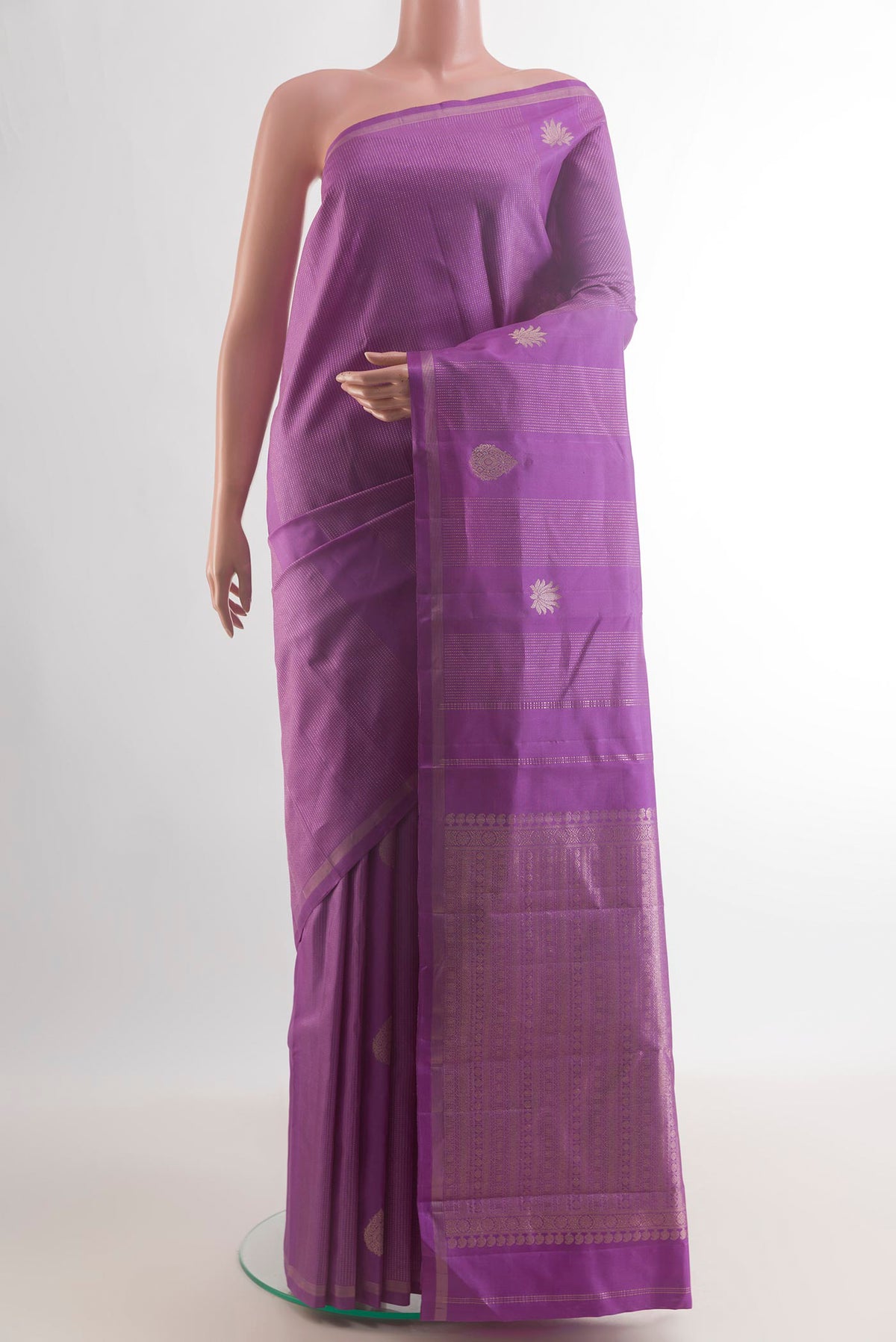 Pure Silk Lavender Kanchipuram Saree with Zari Butta on the body and Zari Border.  displayed on a mannequin