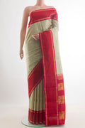 Pure Silk Cream Kanjivaram Saree with Checked design on the body and Zari Border.  displayed on a mannequin