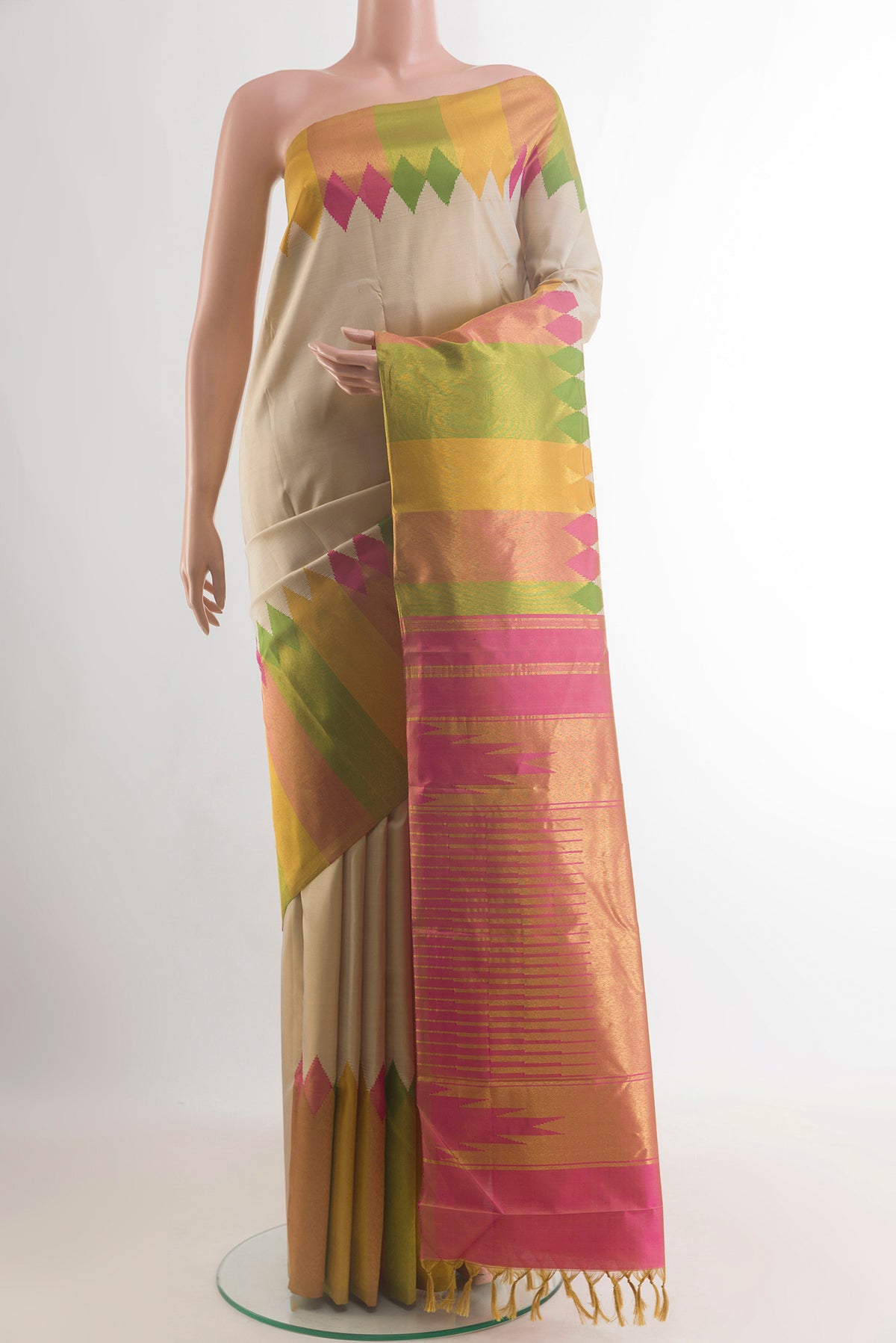 Pure Silk Beige Kanjivaram Saree with Plain Body and Fancy Border.  displayed on a mannequin