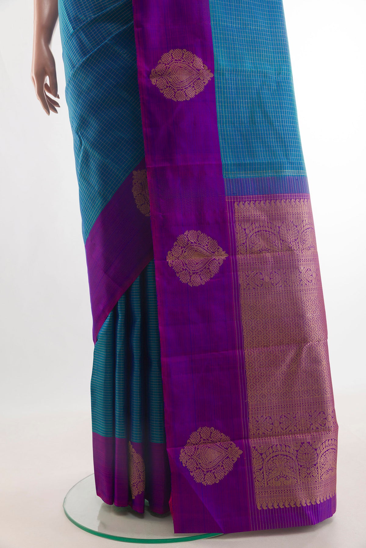Pleats and pallu of Pure Silk Peacock Blue Kanjivaram Saree with Checked design on the body and Zari Border. 
