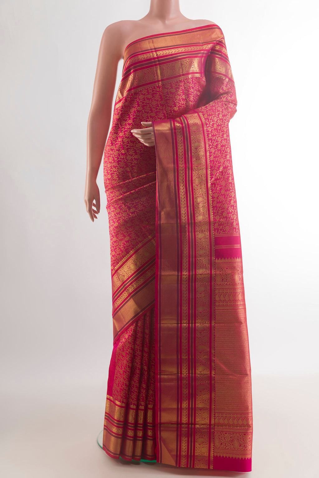 Pure Silk Red Kanchipuram Saree with Zari Brocade on the body and Zari Border.  displayed on a mannequin