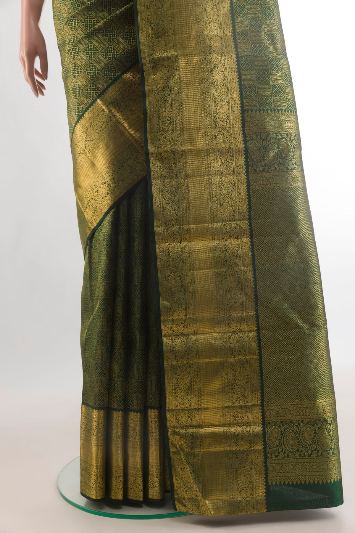 Pleats and pallu of Pure Silk Bottle Green Kanchipuram Saree with Zari Brocade on the body and Zari Border. 