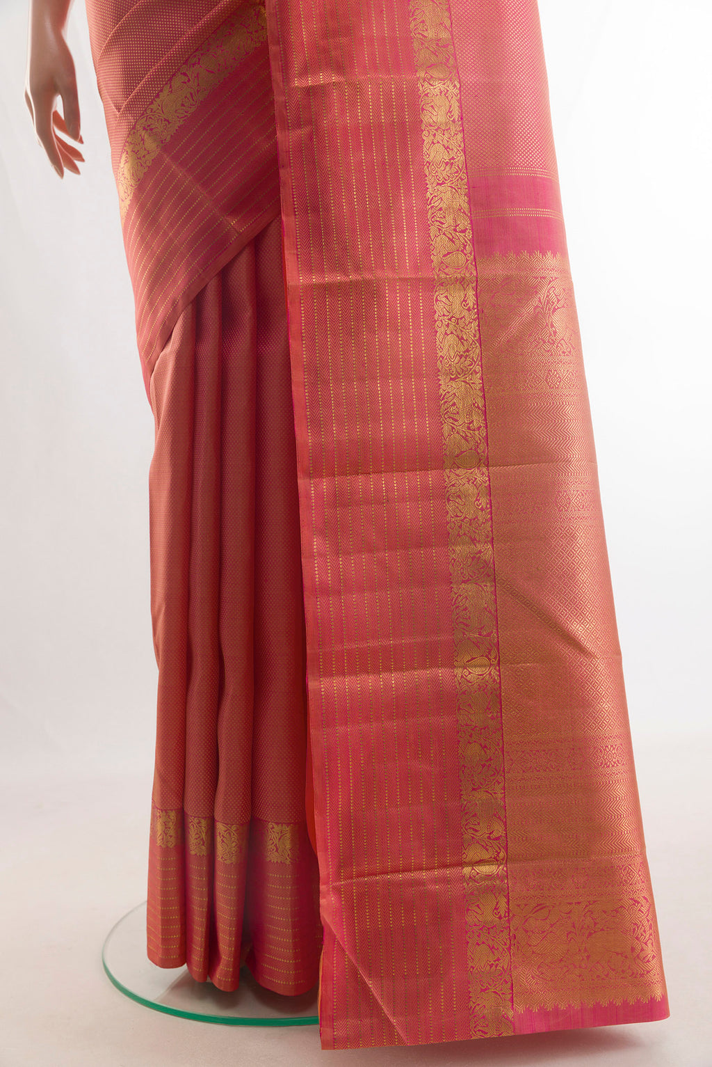 Pleats and pallu of Pure Silk Coral Kanjivaram Saree with Zari Brocade on the body and Zari Border. 