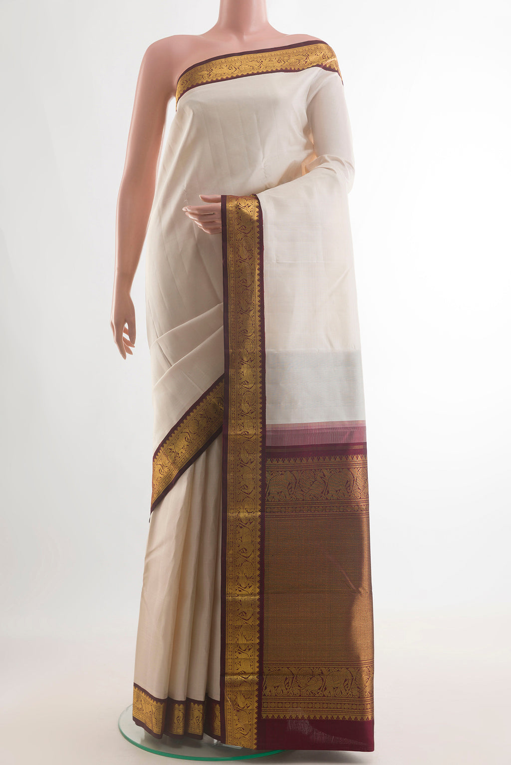 Pure Silk Off White Kanjivaram Saree with Plain Body and Zari Border.  displayed on a mannequin