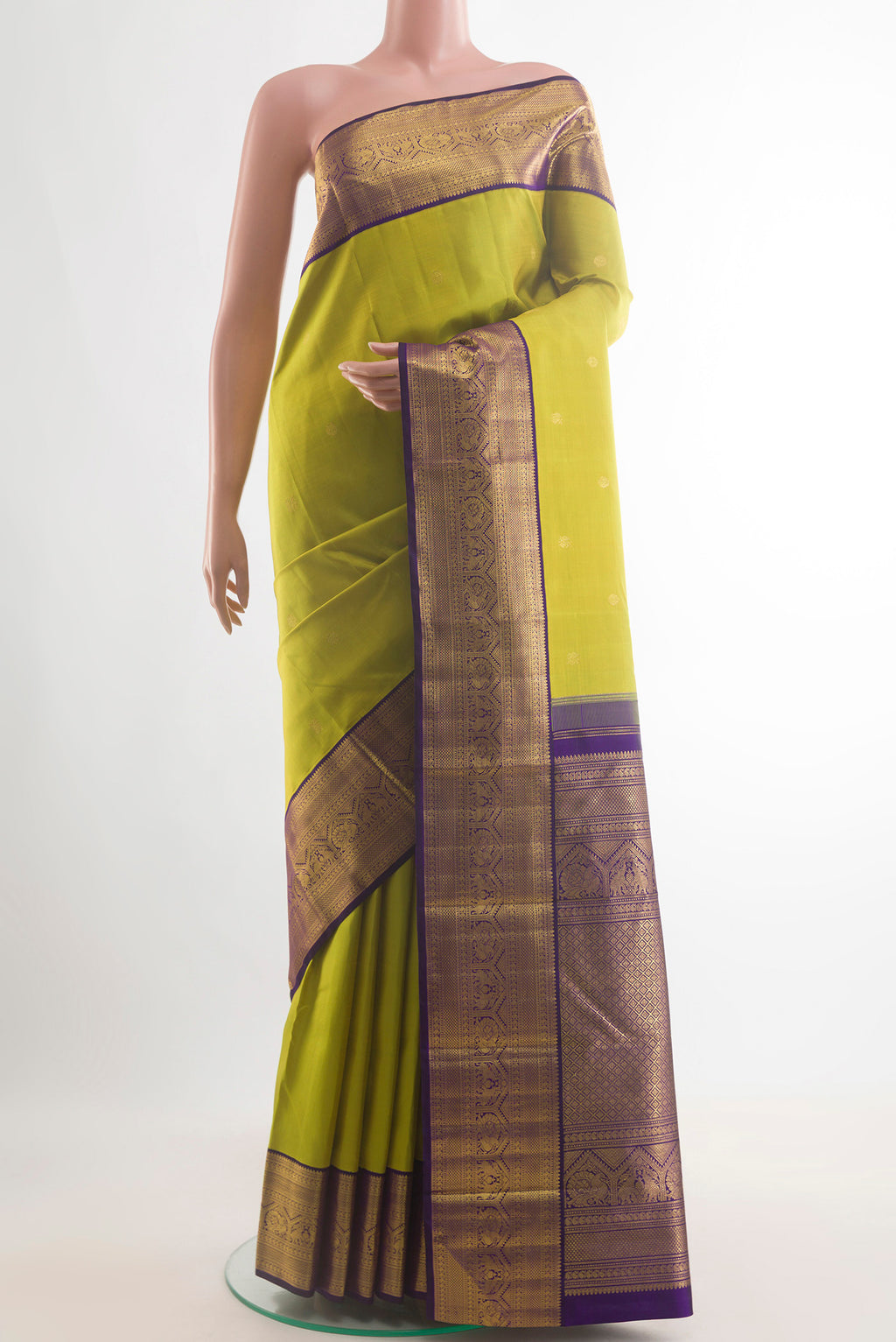 Pure Silk Green Kanchipuram Saree with Zari Butta on the body and Zari Border.  displayed on a mannequin