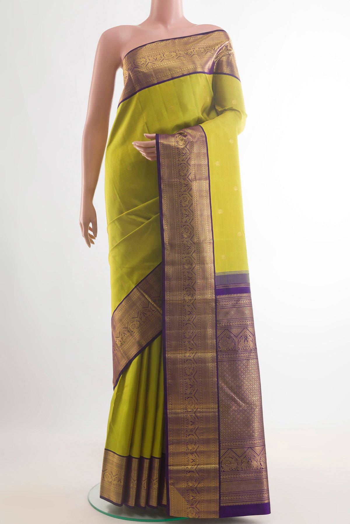 Pure Silk Green Kanchipuram Saree with Zari Butta on the body and Zari Border.  displayed on a mannequin