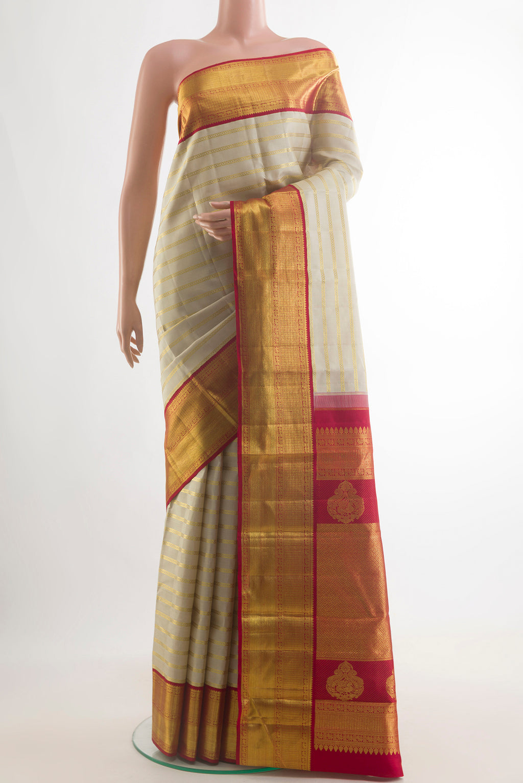 Pure Silk Off White Kanchipuram Saree with Stripes on the body and Zari Border.  displayed on a mannequin