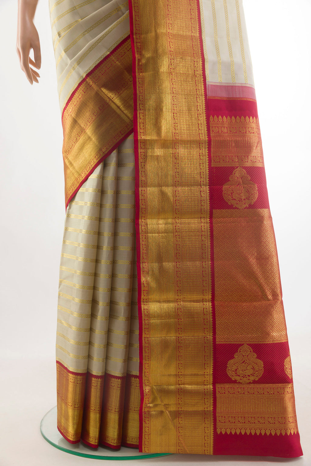 Pleats and pallu of Pure Silk Off White Kanchipuram Saree with Stripes on the body and Zari Border. 