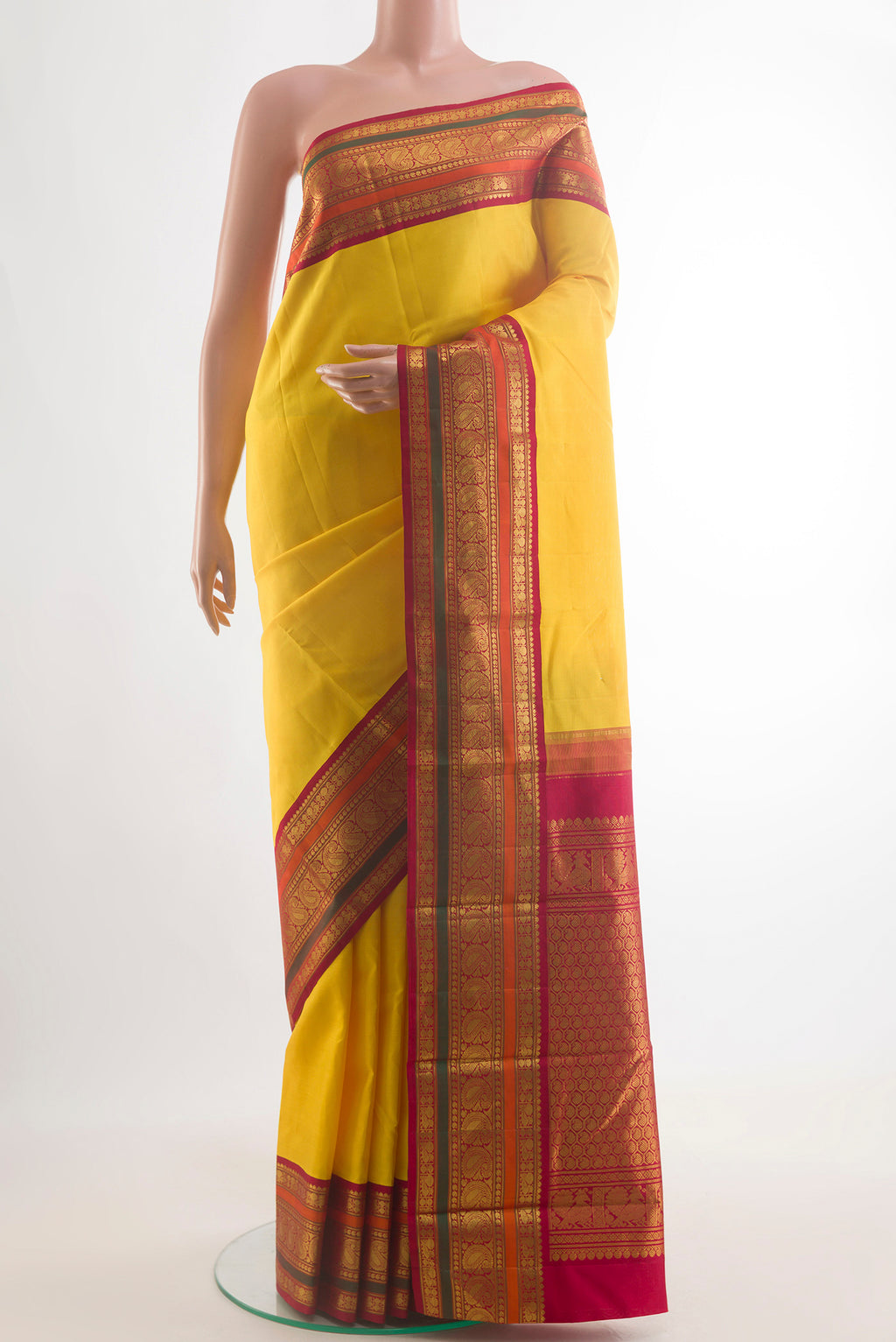 Pure Silk Yellow Kanjivaram Saree with Plain Body and Zari Border.  displayed on a mannequin