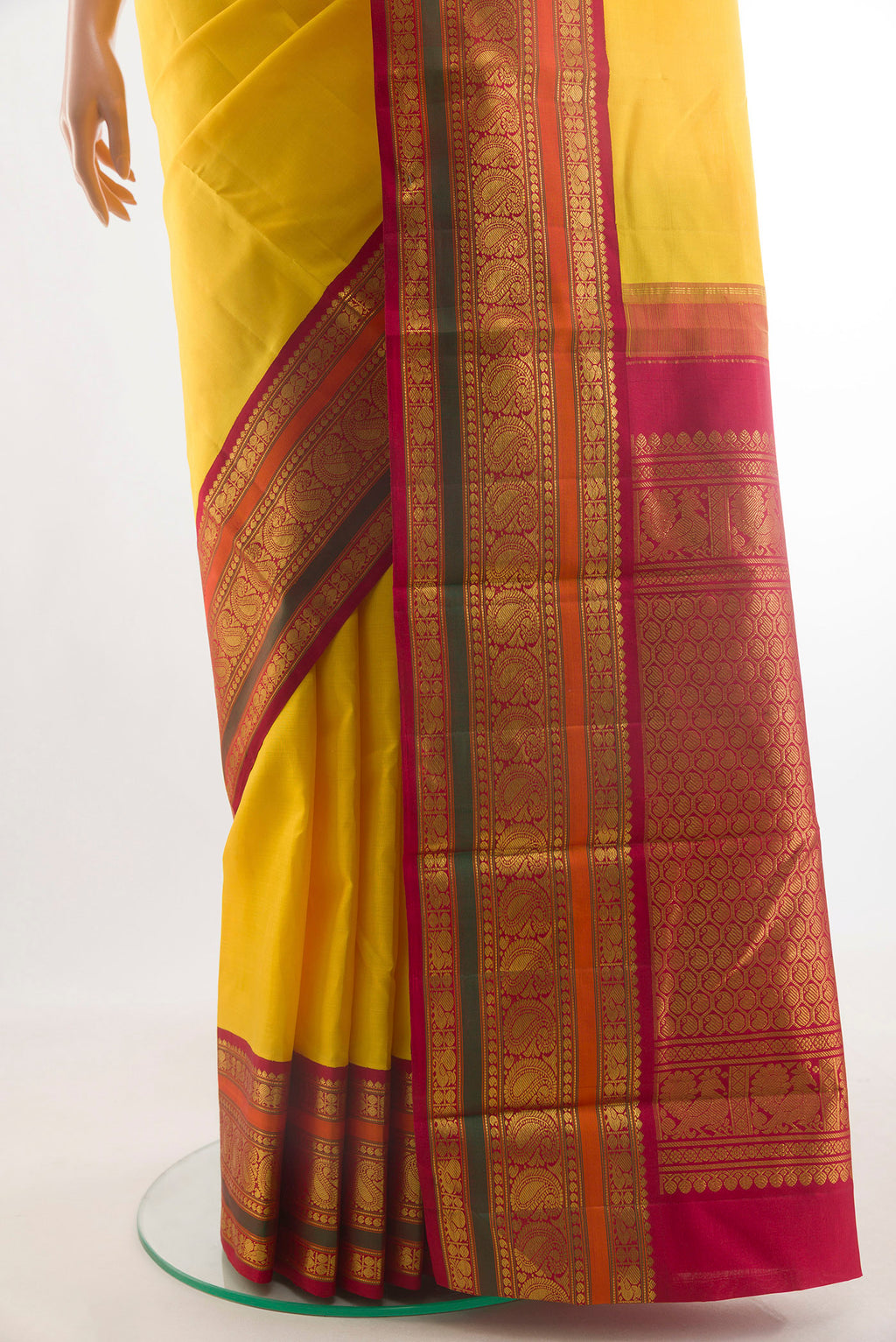 Pleats and pallu of Pure Silk Yellow Kanjivaram Saree with Plain Body and Zari Border. 