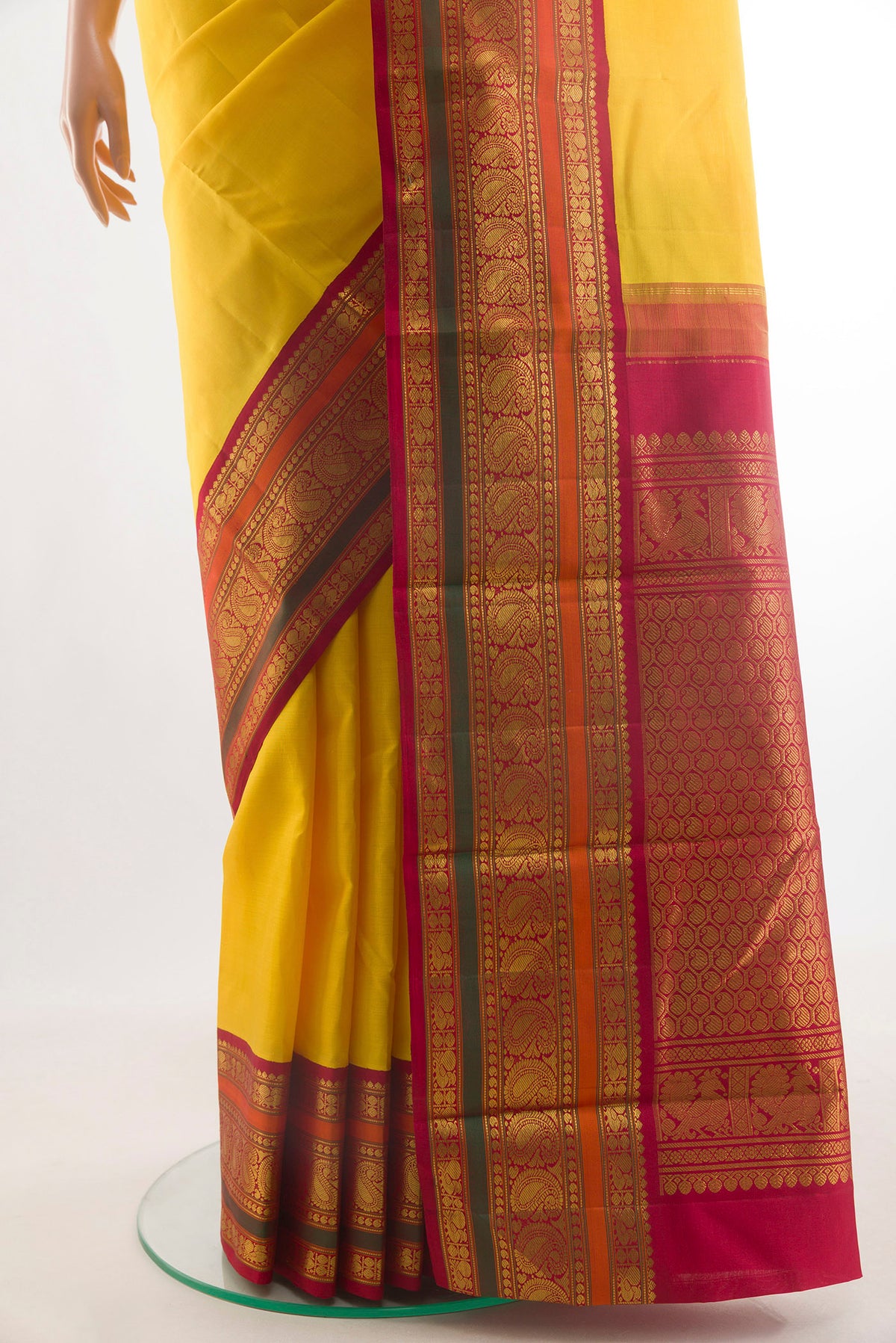 Pleats and pallu of Pure Silk Yellow Kanjivaram Saree with Plain Body and Zari Border. 