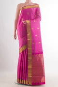 Pure Silk Pink Kanchipuram Saree with Zari Butta on the body and Zari Border.  displayed on a mannequin