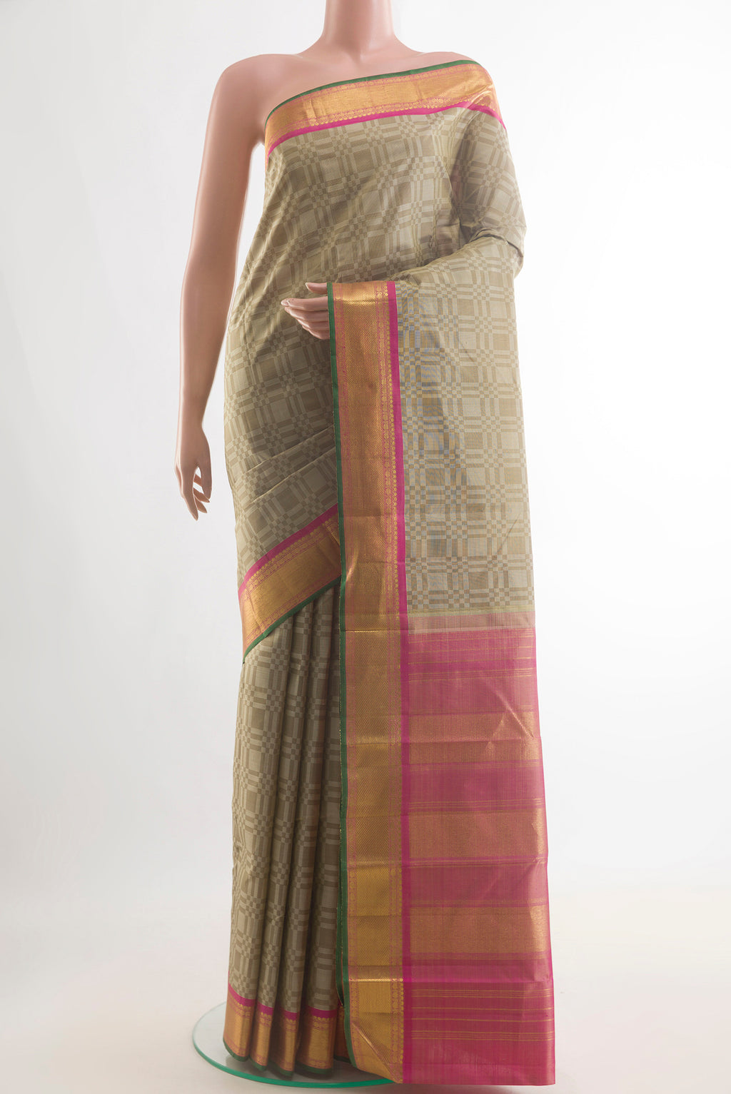 Pure Silk Beige Kanjivaram Saree with Jacquard design on the body and Zari Border.  displayed on a mannequin