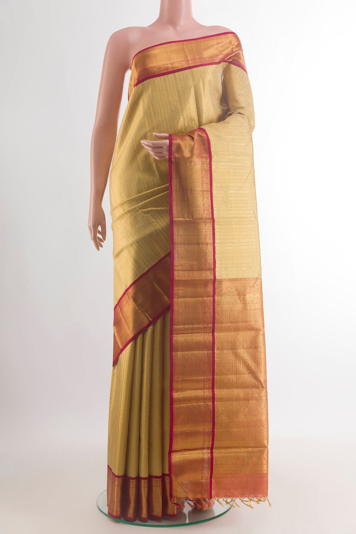 Pure Silk Golden Kanjivaram Saree with Zari Brocade on the body and Zari Border.  displayed on a mannequin