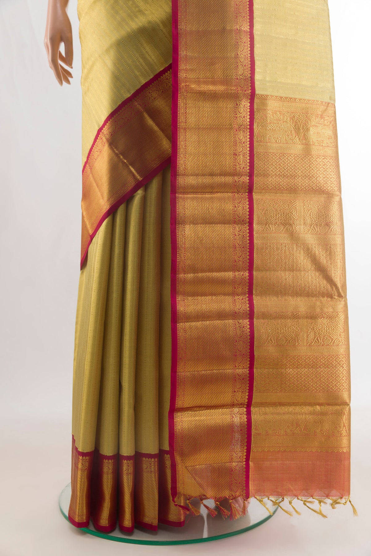 Pleats and pallu of Pure Silk Golden Kanjivaram Saree with Zari Brocade on the body and Zari Border. 