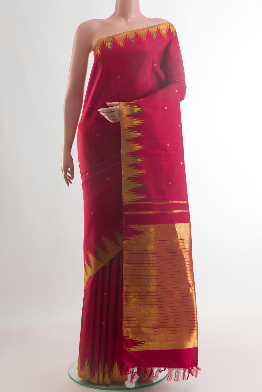 Pure Silk Red Kanchipuram Saree with Zari Butta on the body and Temple Border.  displayed on a mannequin