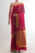 Pure Silk Red Kanchipuram Saree with Zari Butta on the body and Temple Border.  displayed on a mannequin