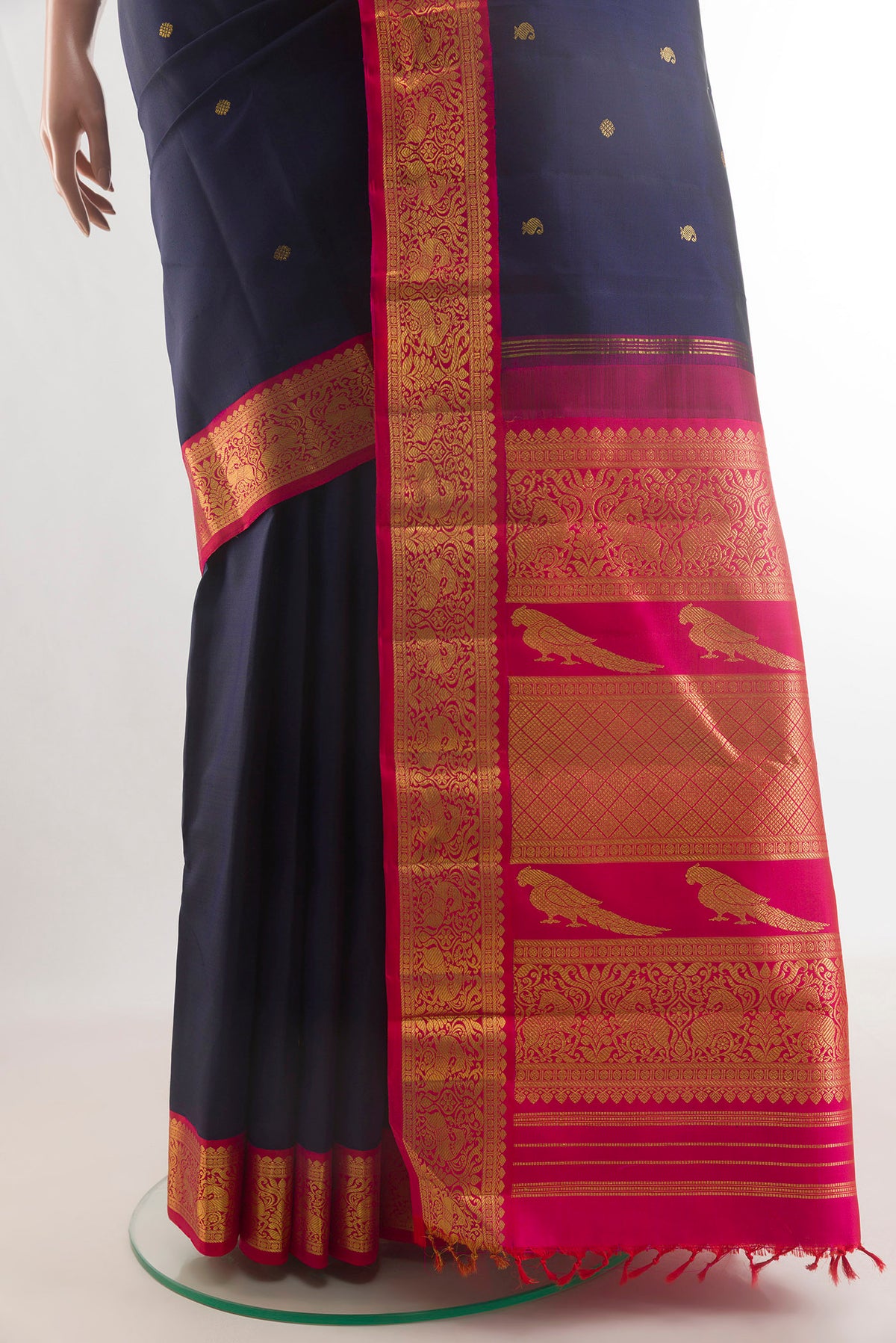 Pleats and pallu of Pure Silk Navy Blue Kanchipuram Saree with Zari Butta on the body and Zari Border. 