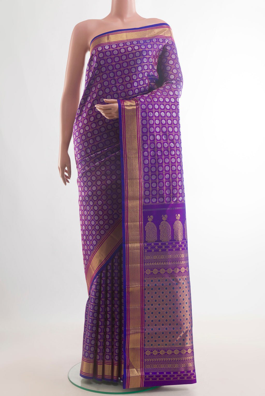 Pure Silk Purple Kanchipuram Saree with Zari Brocade on the body and Zari Border.  displayed on a mannequin