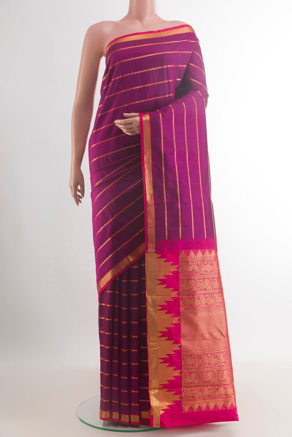 Pure Silk Purple Kanchipuram Saree with Stripes on the body and Zari Border.  displayed on a mannequin
