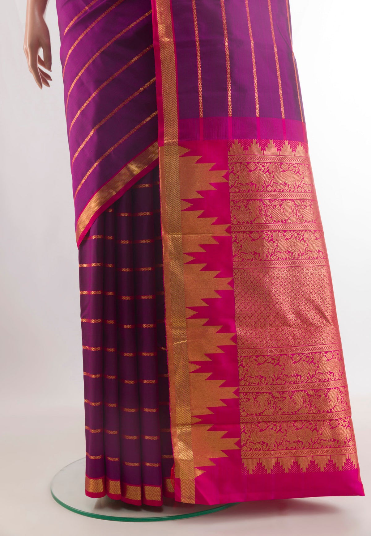 Pleats and pallu of Pure Silk Purple Kanchipuram Saree with Stripes on the body and Zari Border. 