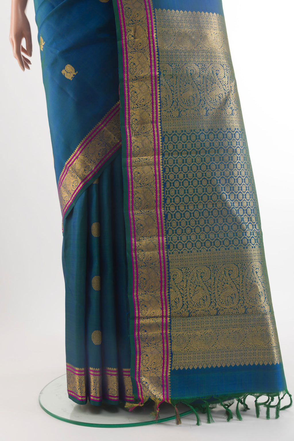 Pleats and pallu of Pure Silk Peacock Blue Kanchipuram Saree with Zari Butta on the body and Zari Border. 
