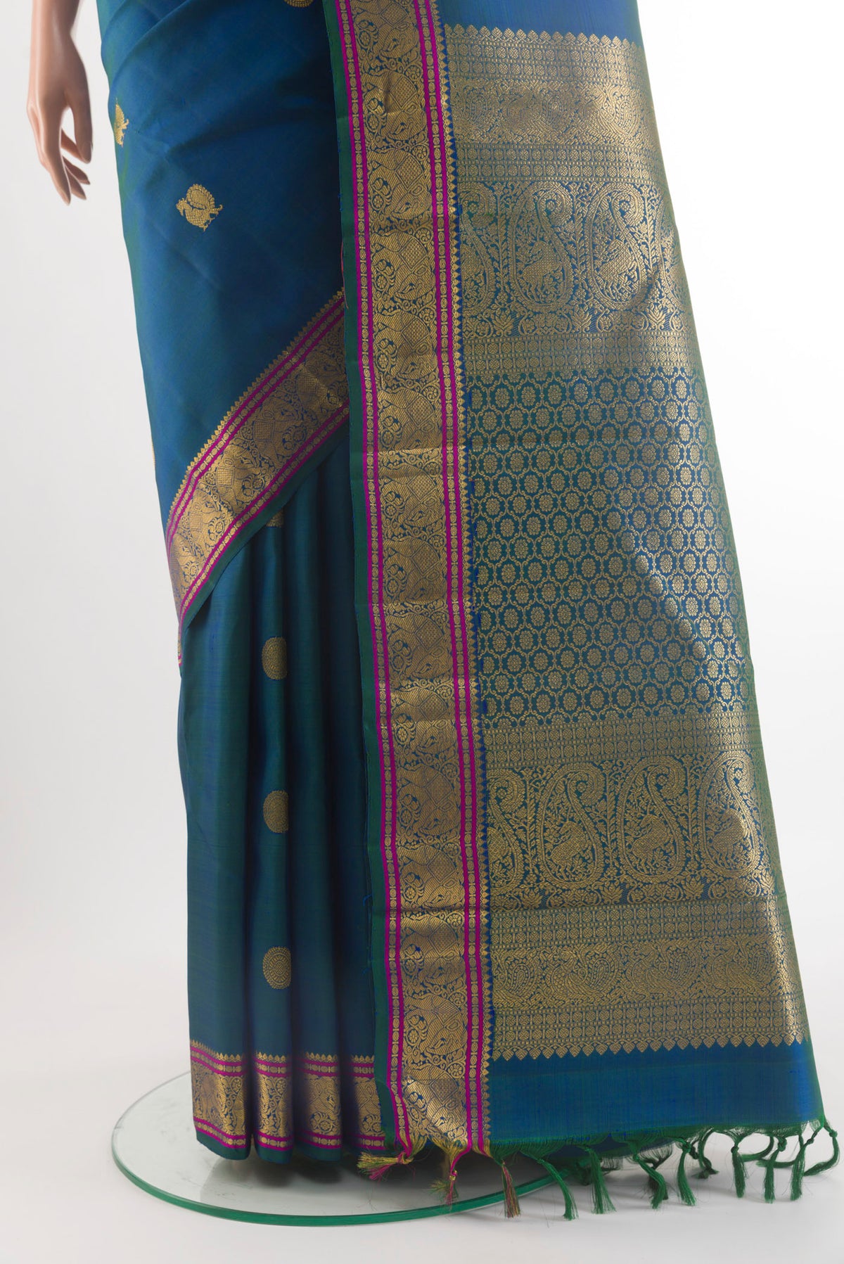 Pleats and pallu of Pure Silk Peacock Blue Kanchipuram Saree with Zari Butta on the body and Zari Border. 