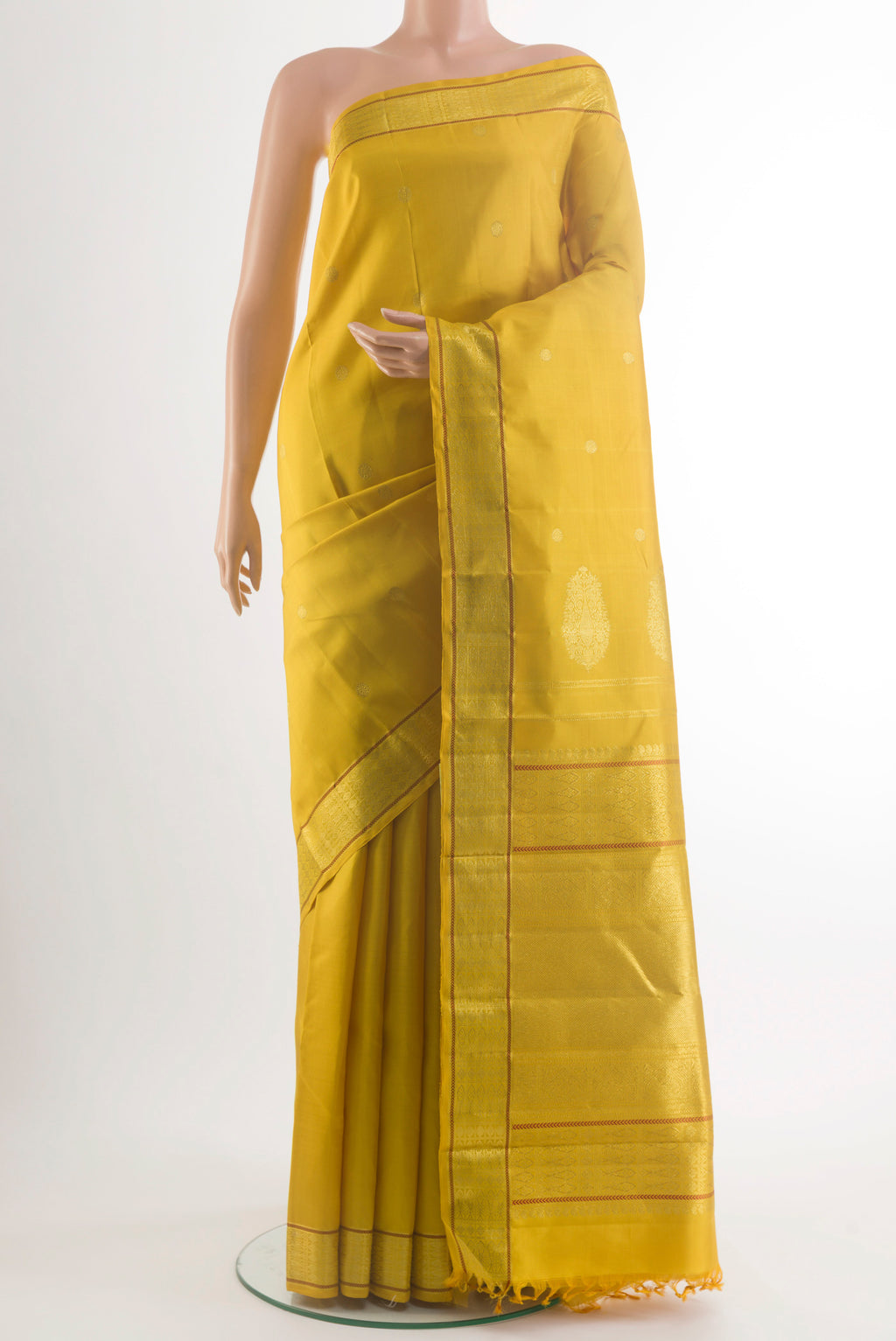 Pure Silk Yellow Kanchipuram Saree with Zari Butta on the body and Zari Border.  displayed on a mannequin
