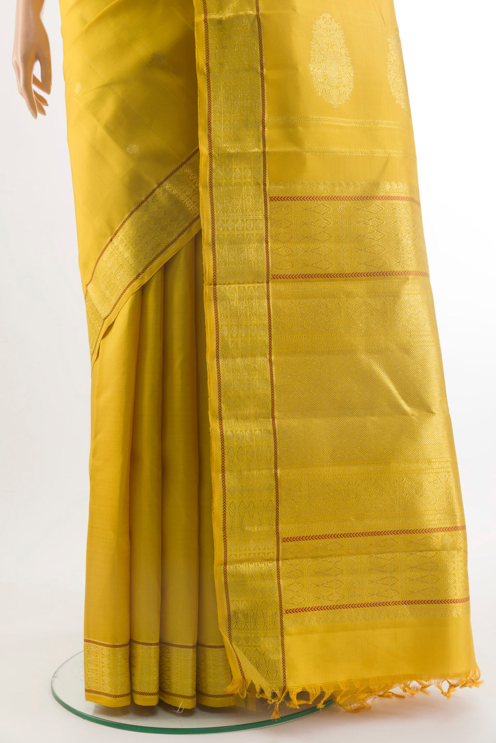 Pleats and pallu of Pure Silk Yellow Kanchipuram Saree with Zari Butta on the body and Zari Border. 
