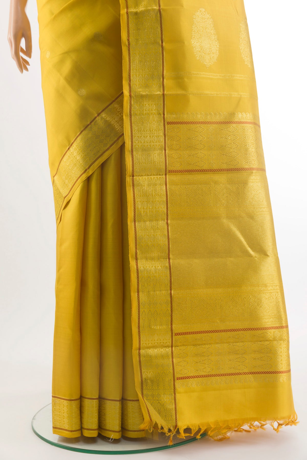 Pleats and pallu of Pure Silk Yellow Kanchipuram Saree with Zari Butta on the body and Zari Border. 
