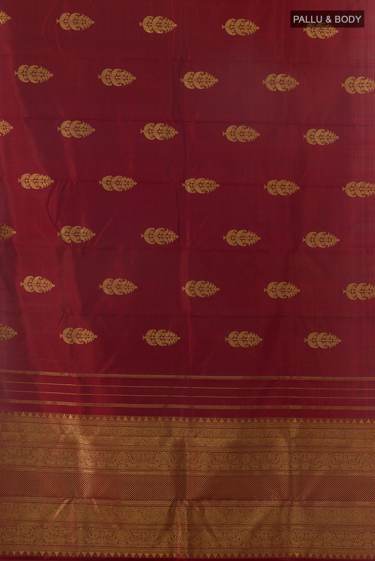 Flat view of Pure Silk Rust Kanjivaram Saree with Zari Butta on the body and Without Border. 