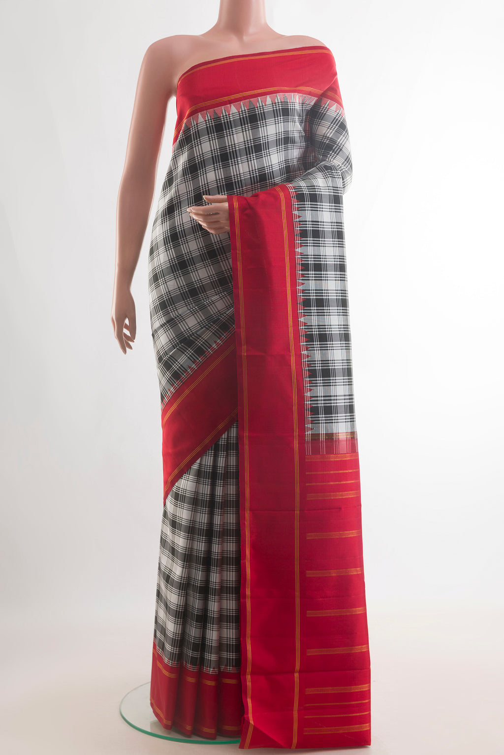 Pure Silk Pure Zari Off White Kanjivaram Saree with Checked design on the body and Zari Border.  displayed on a mannequin