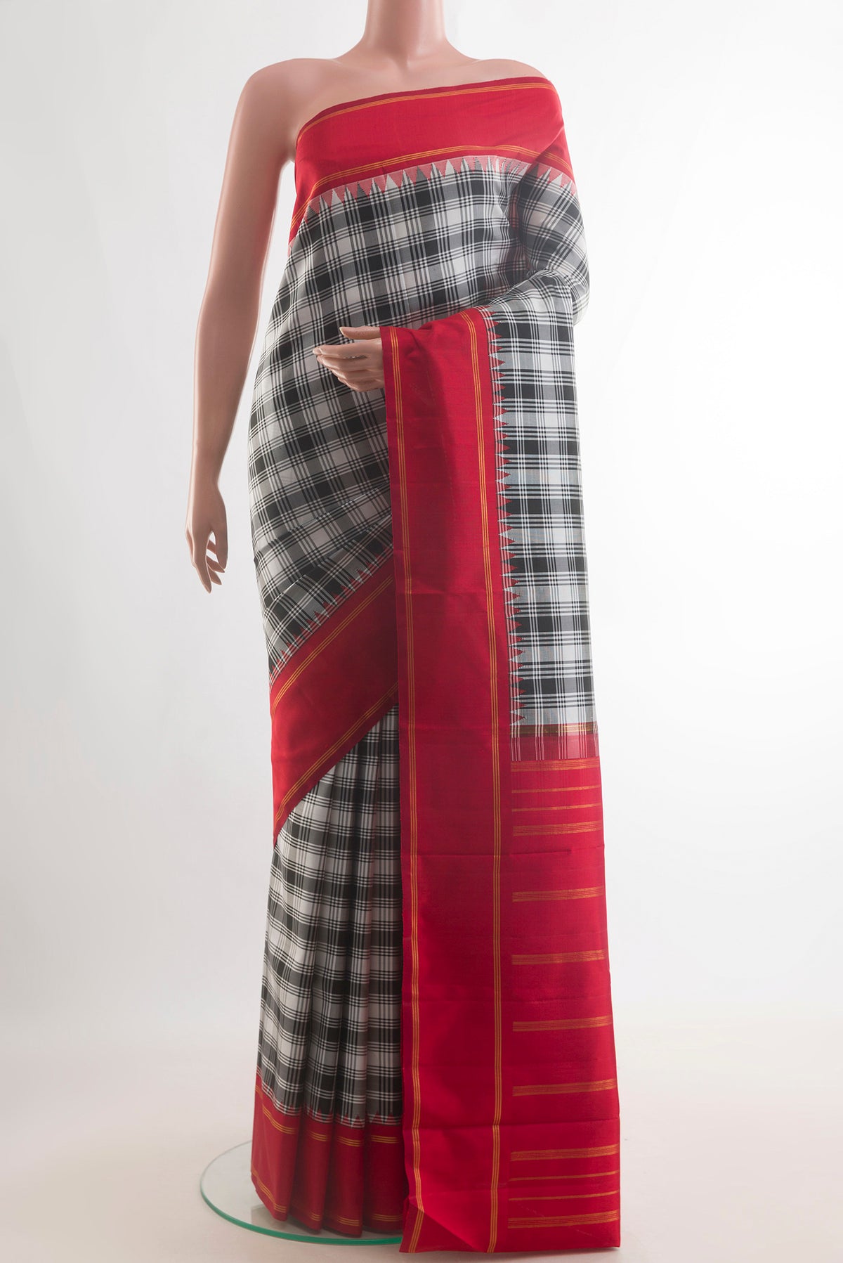 Pure Silk Pure Zari Off White Kanjivaram Saree with Checked design on the body and Zari Border.  displayed on a mannequin