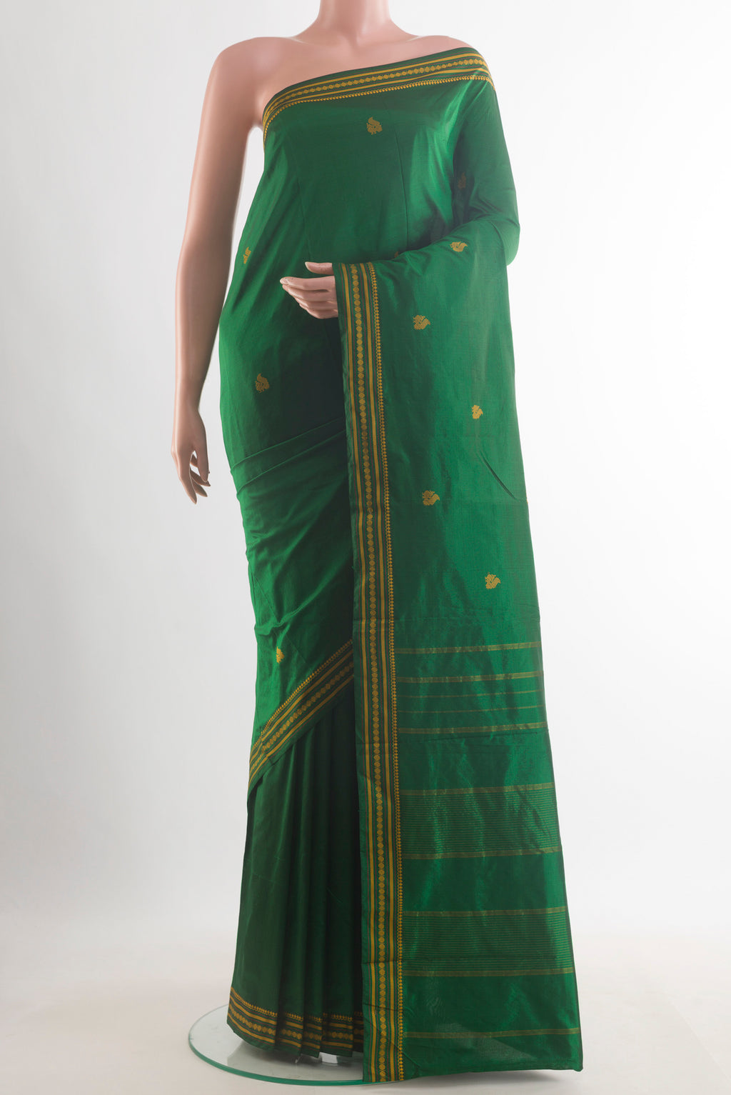Pure Silk Green Kanchipuram Saree with Thread Butta on the body and Thread Border.  displayed on a mannequin