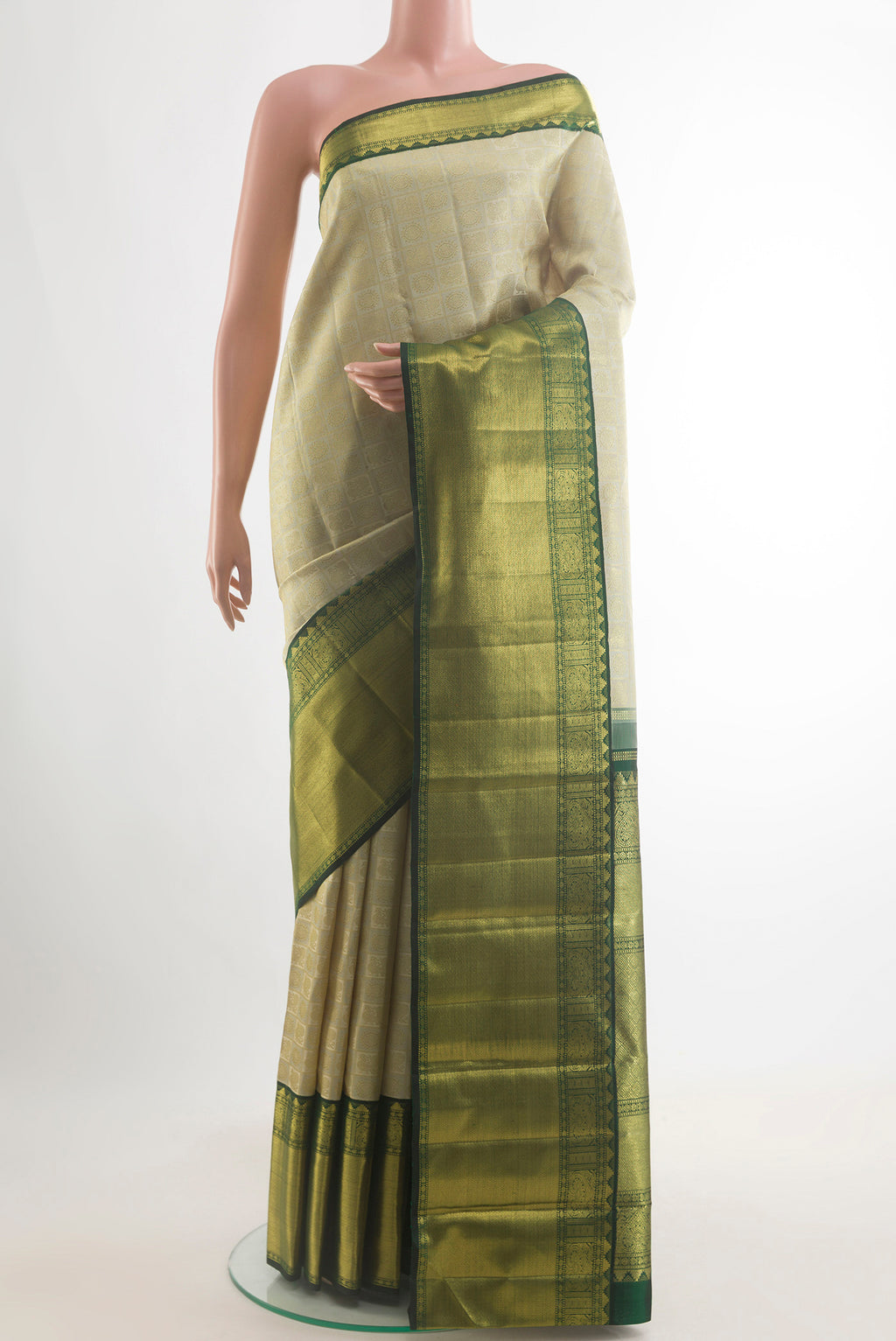 Pure Silk Pure Zari Off White Kanjivaram Saree with Zari Brocade on the body and Zari Border.  displayed on a mannequin