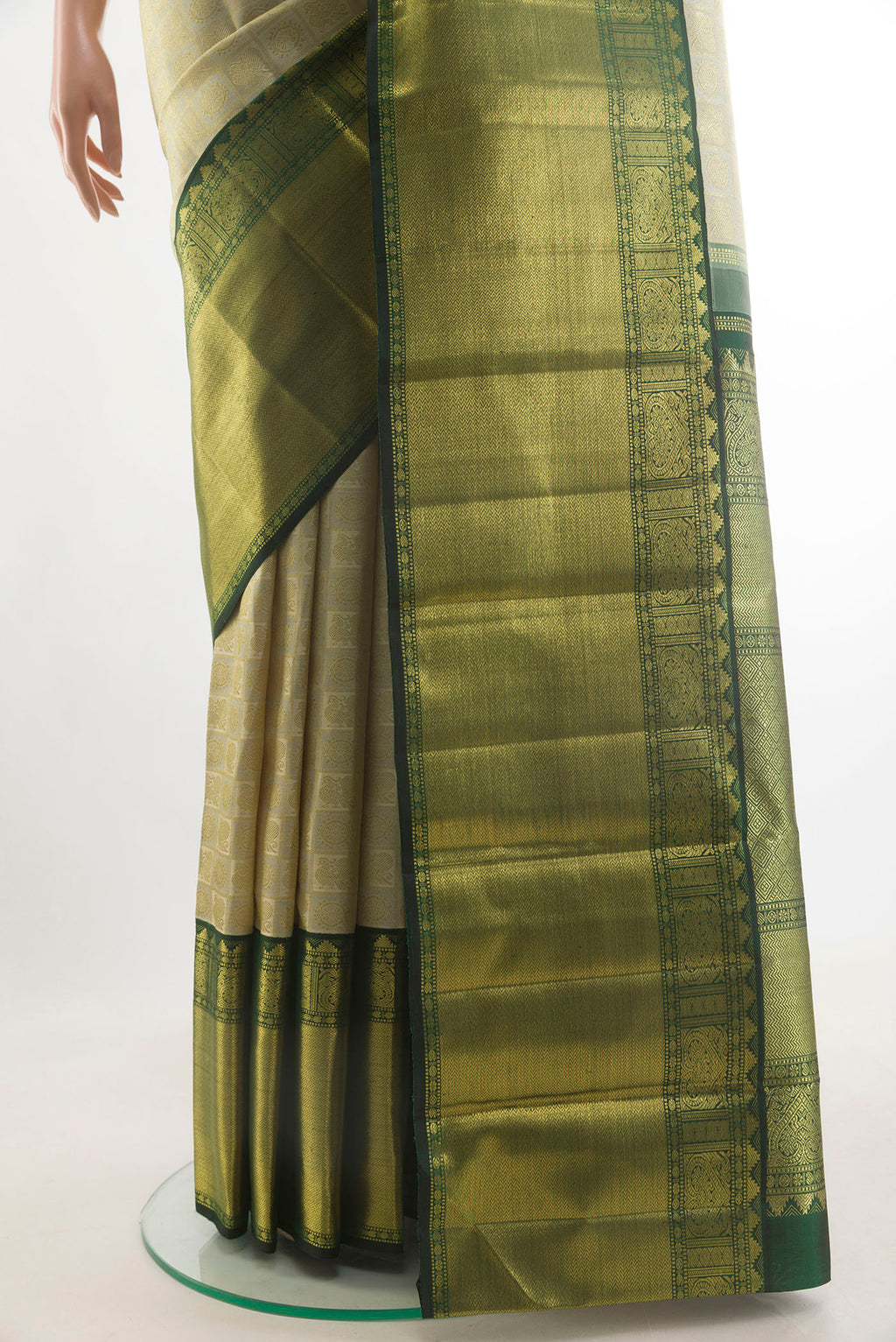 Pleats and pallu of Pure Silk Pure Zari Off White Kanjivaram Saree with Zari Brocade on the body and Zari Border. 