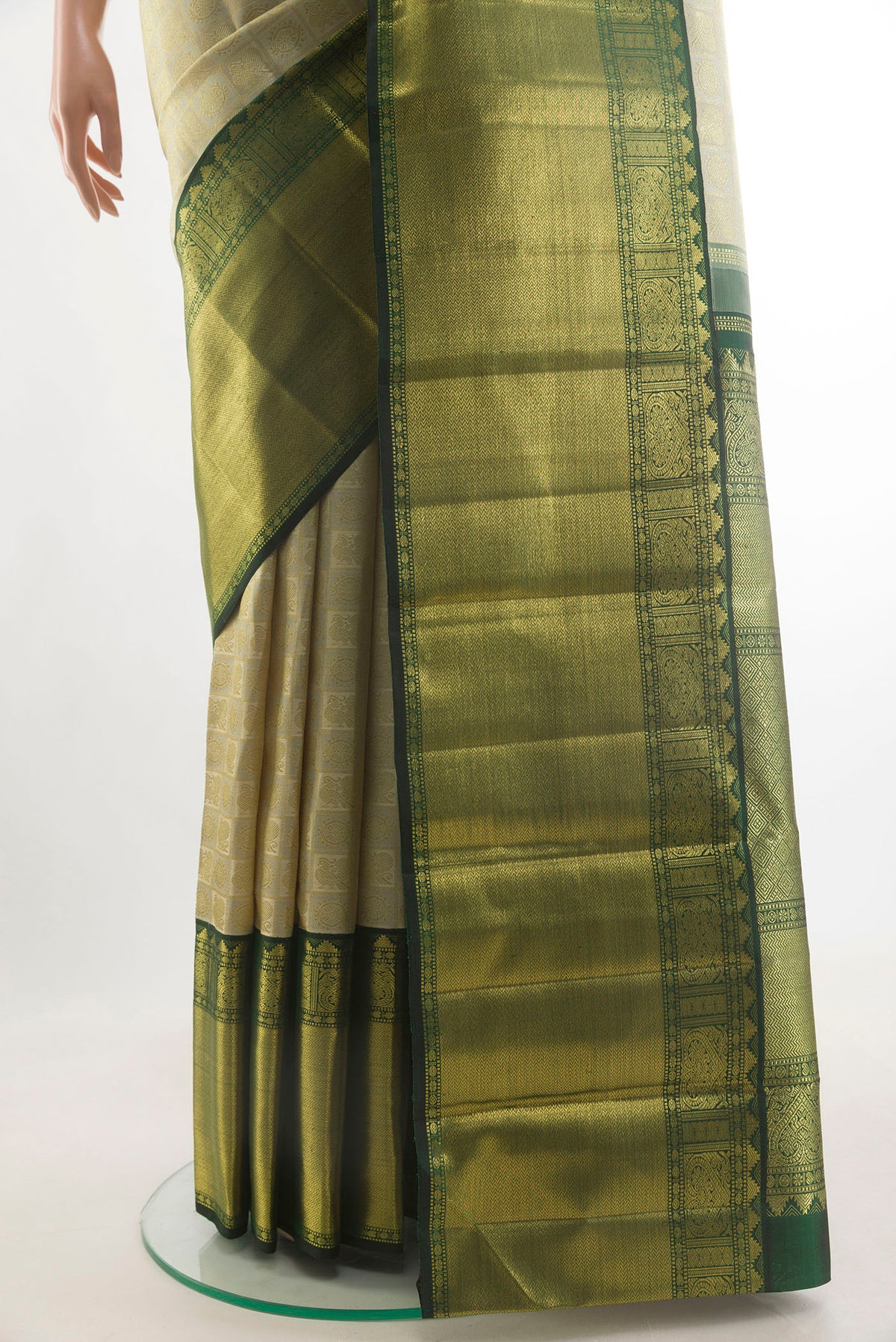 Pleats and pallu of Pure Silk Pure Zari Off White Kanjivaram Saree with Zari Brocade on the body and Zari Border. 