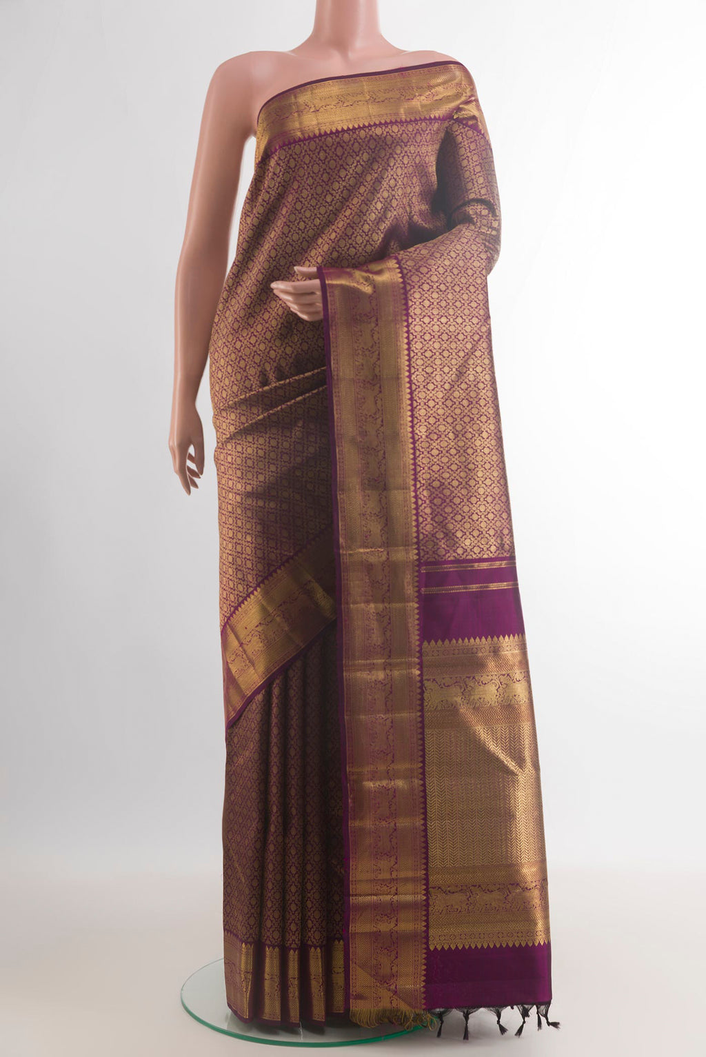 Pure Silk Purple Kanjivaram Saree with Zari Brocade on the body and Zari Border.  displayed on a mannequin