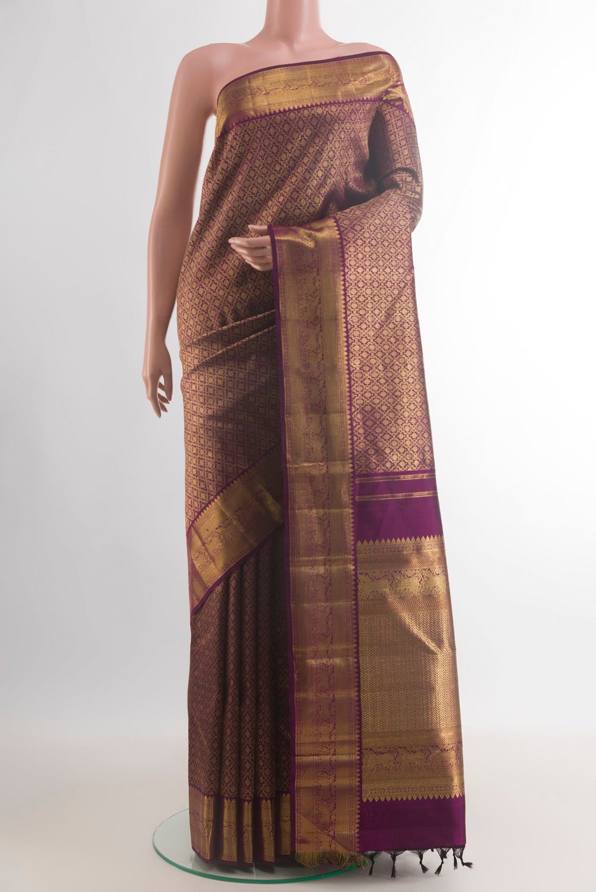 Pure Silk Purple Kanjivaram Saree with Zari Brocade on the body and Zari Border.  displayed on a mannequin