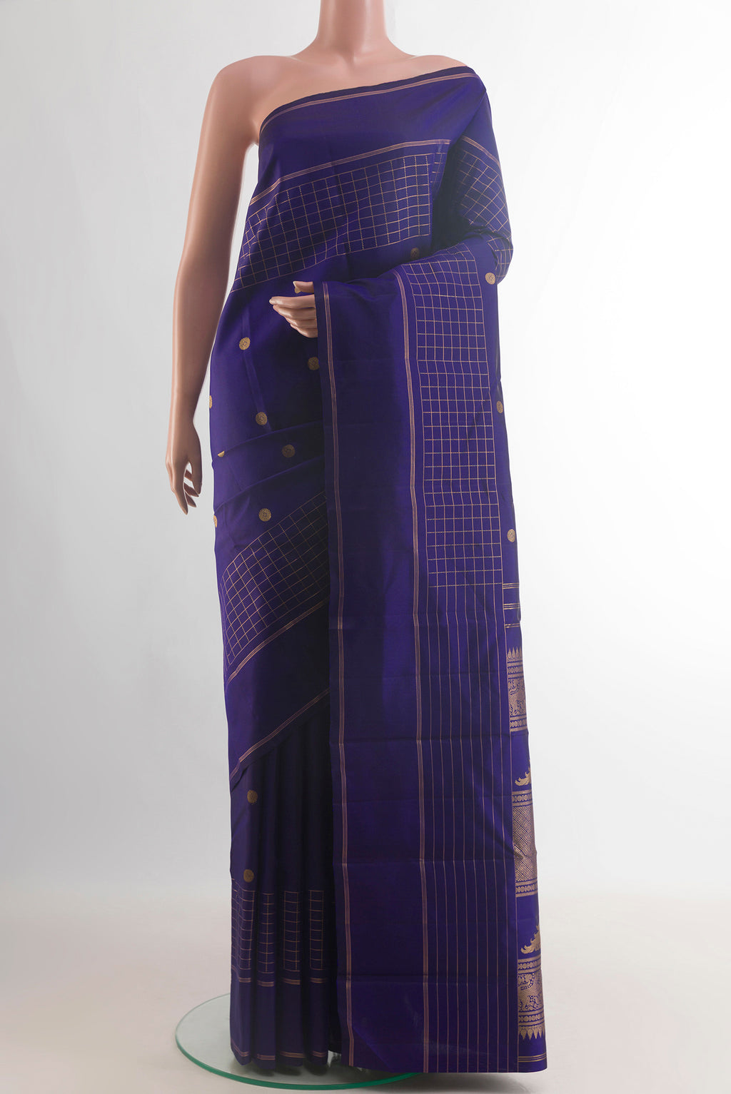 Pure Silk Blue Kanjivaram Saree with Zari Butta on the body and Zari Border.  displayed on a mannequin