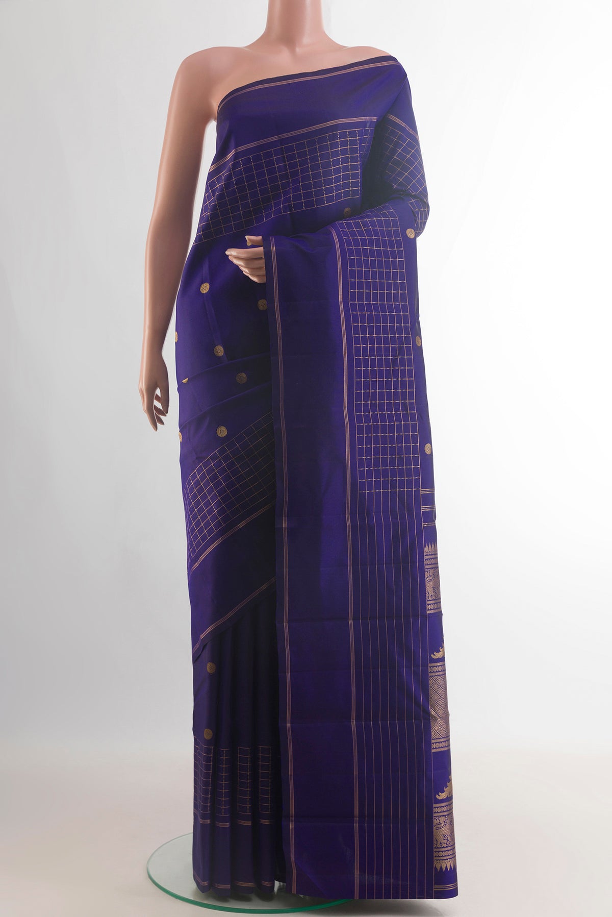 Pure Silk Blue Kanjivaram Saree with Zari Butta on the body and Zari Border.  displayed on a mannequin