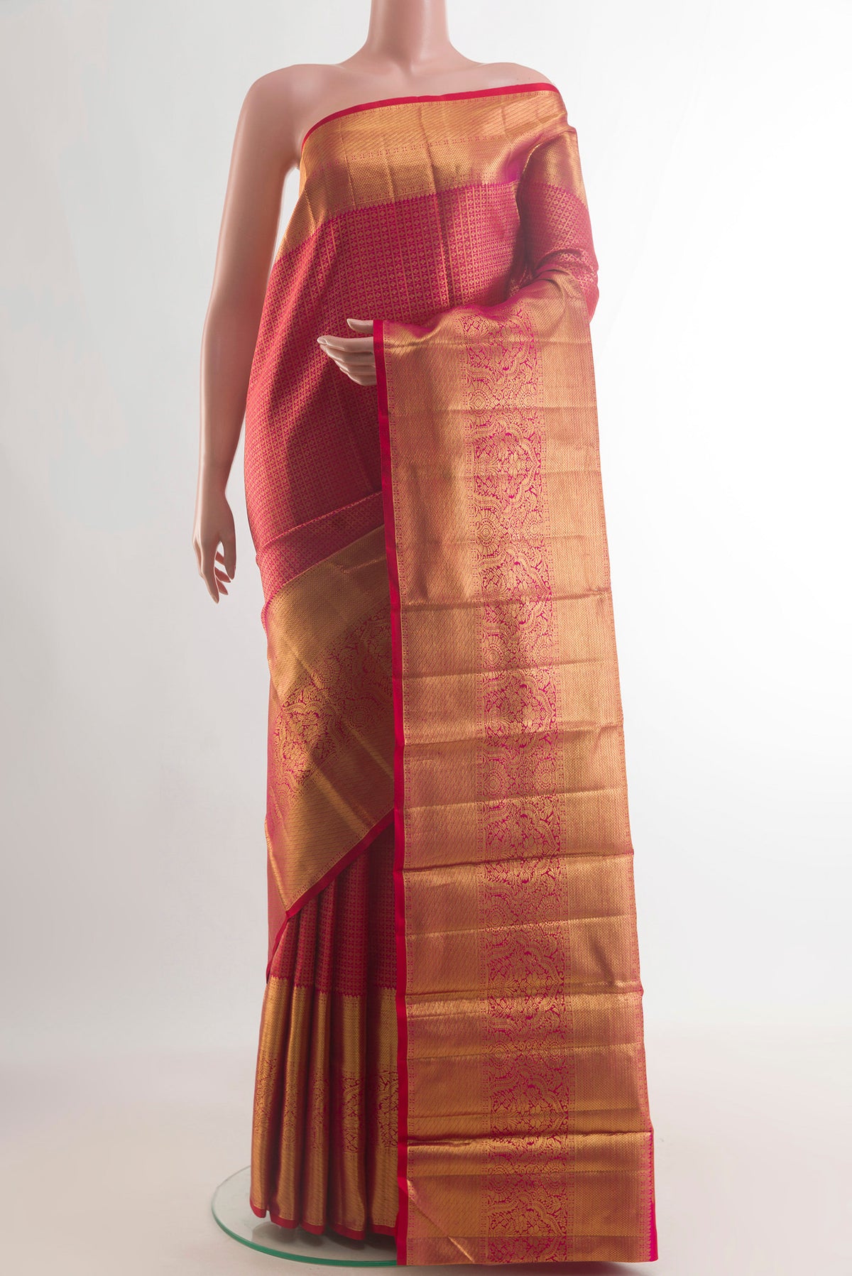 Pure Silk Red Kanchipuram Saree with Zari Brocade on the body and Zari Border.  displayed on a mannequin