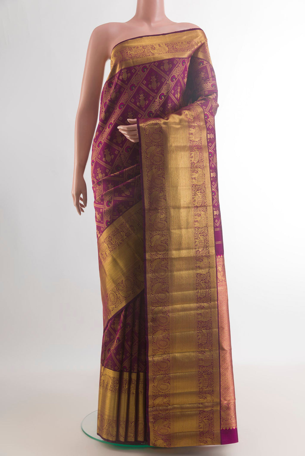 Pure Silk Purple Kanchipuram Saree with Zari Brocade on the body and Zari Border.  displayed on a mannequin