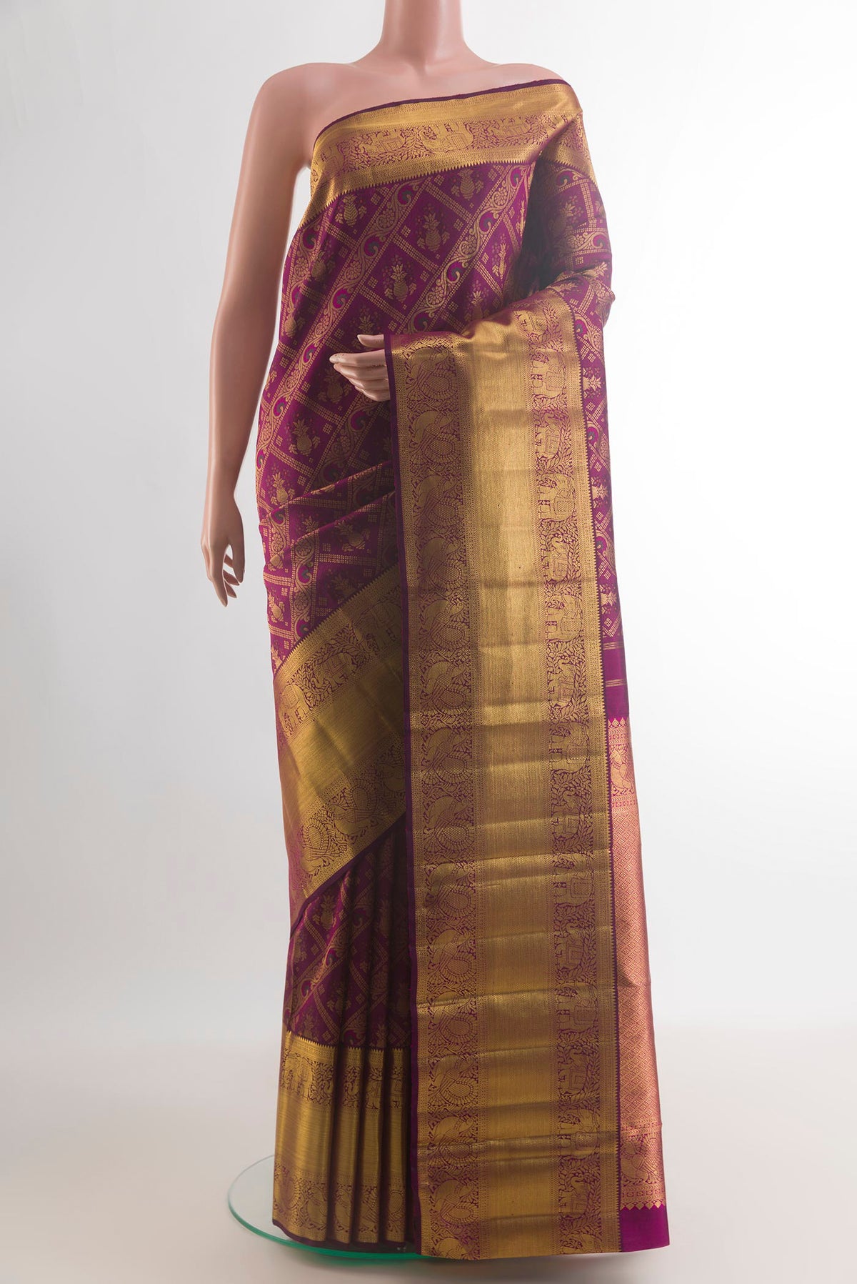 Pure Silk Purple Kanchipuram Saree with Zari Brocade on the body and Zari Border.  displayed on a mannequin