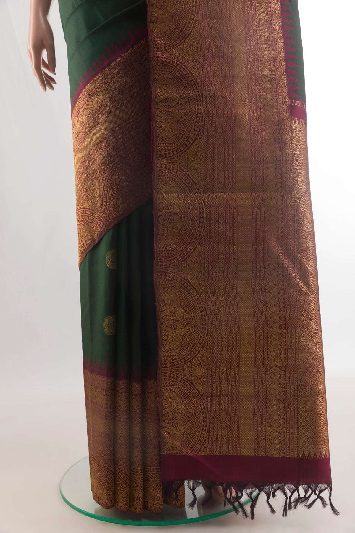 Pleats and pallu of Pure Silk Green Kanchipuram Saree with Zari Butta on the body and Zari Border. 