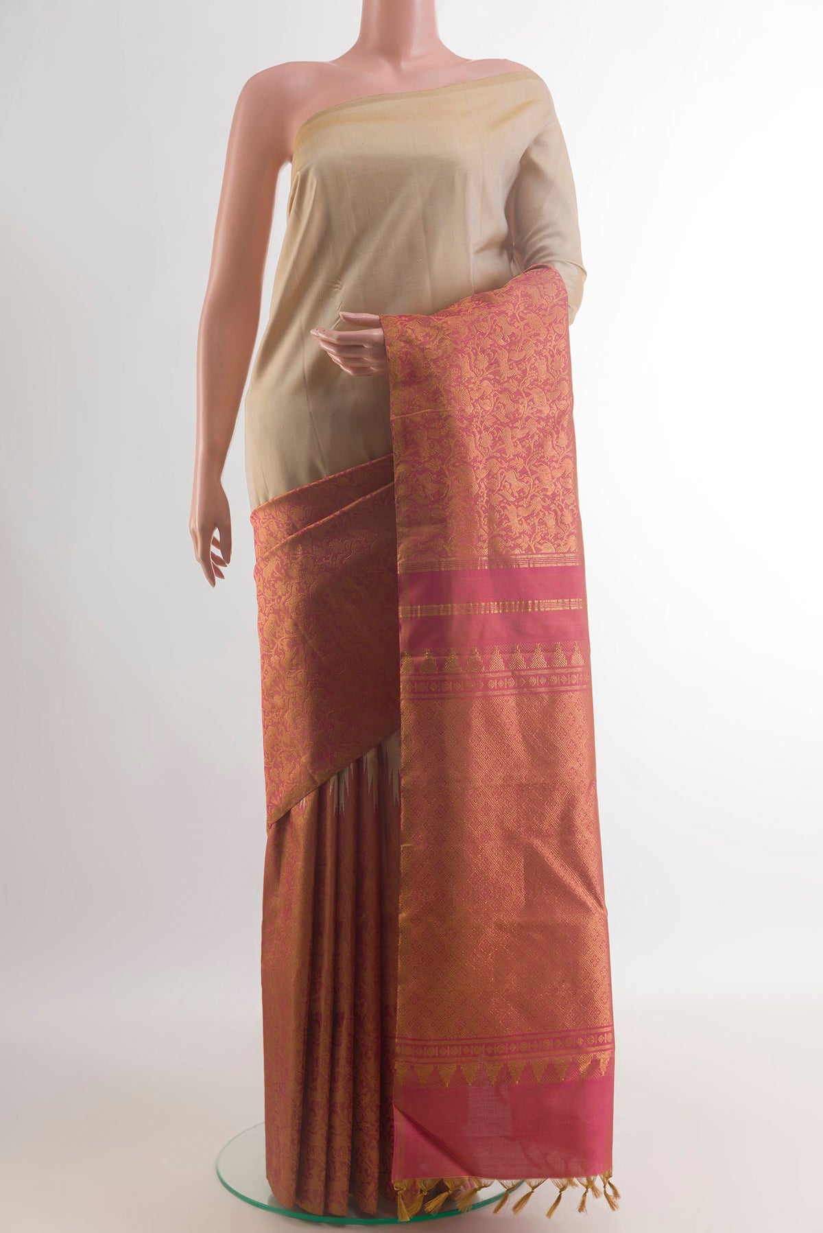 Pure Silk Beige Kanchipuram Saree with Plain Body and Temple Border.  displayed on a mannequin